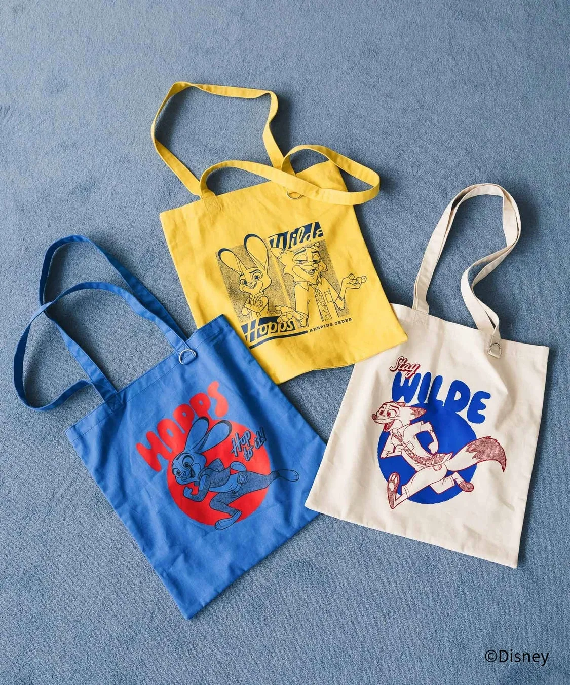 3つのトートバッグが並んでいる写真。それぞれのバッグには、映画「ズートピア」のキャラクターが描かれています。